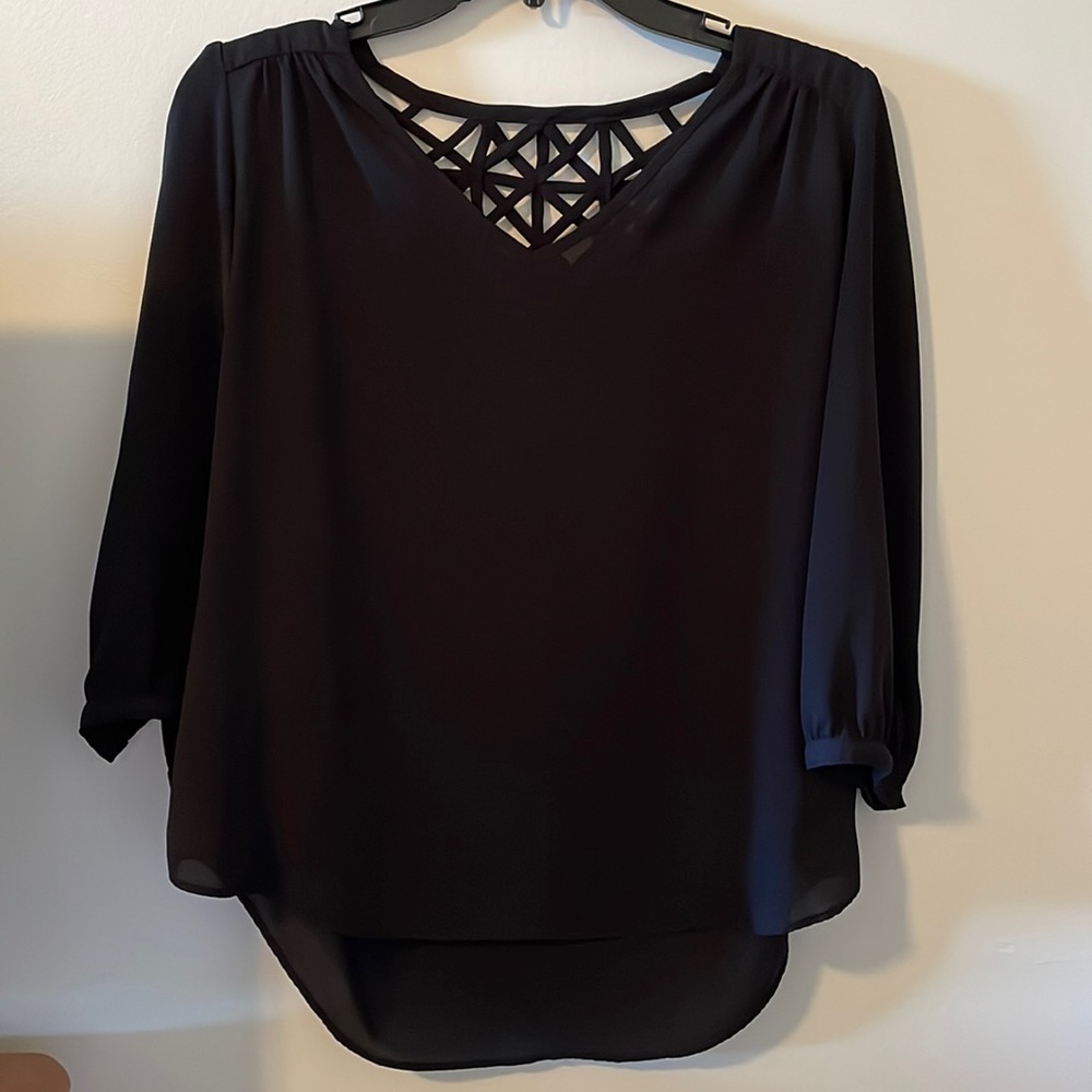 Women’s black blouse.